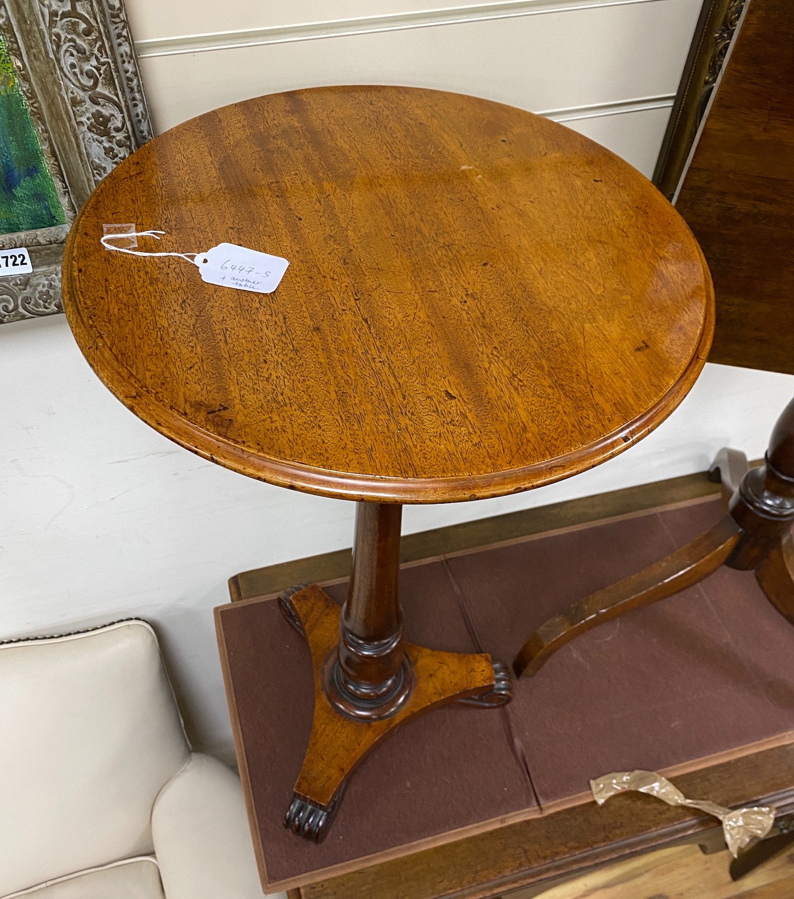 An early 19th century mahogany tilt top tripod wine table and a Victorian circular wine table, larger width 47cm, height 61cm